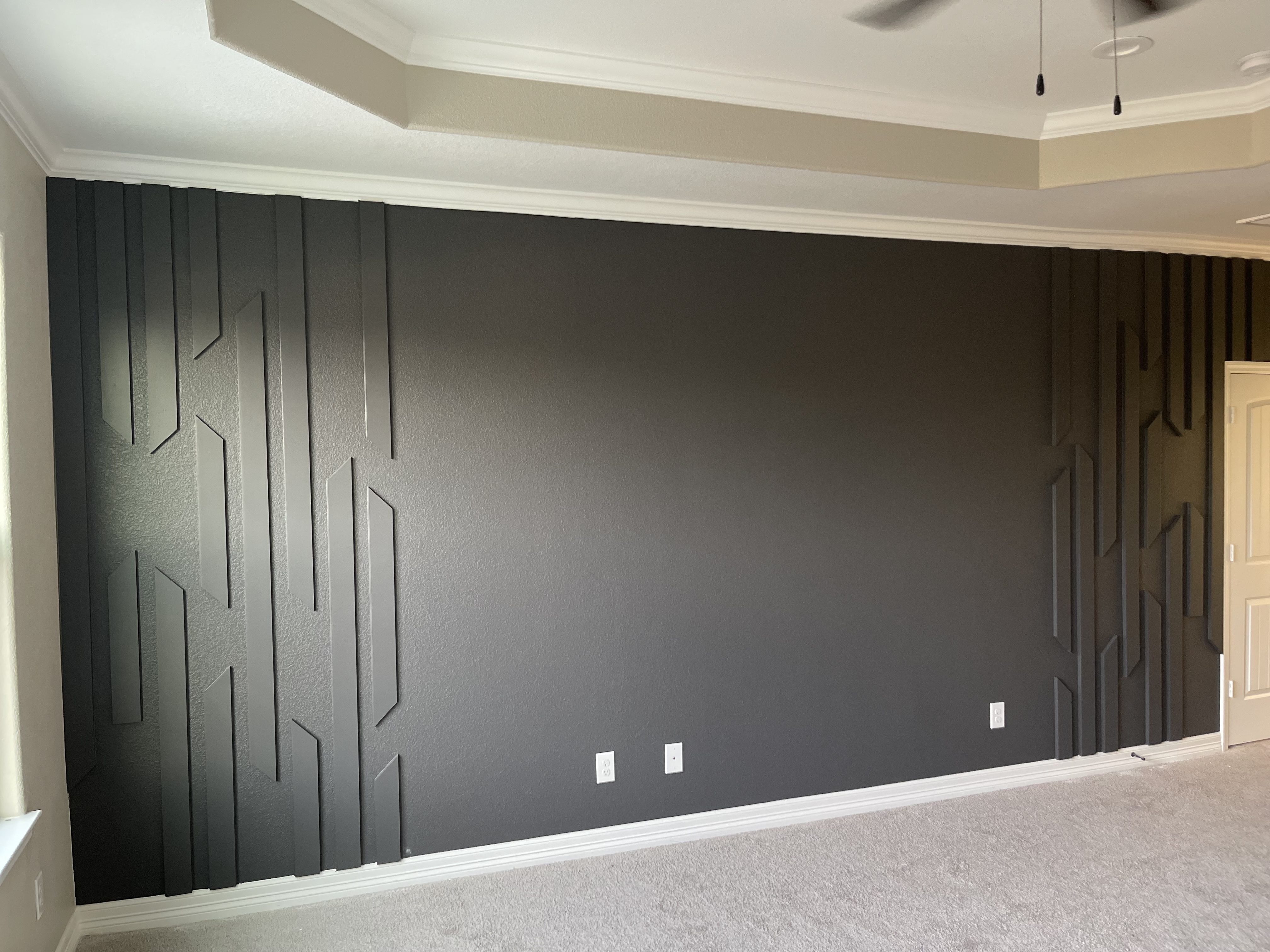 Large geometric accent wall in bedroom
